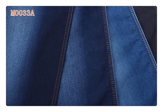 Prezzo buono La falsificazione blu scuro del poliestere del cotone della saia del ringrosso ha tricottato il tessuto del denim in linea
