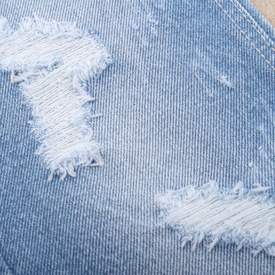 Prezzo buono Tessuti rigidi in denim di cotone al 100% per jeans e abbigliamento in linea