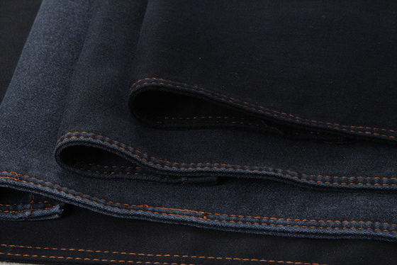Prezzo buono tessuto nero di Chambray del denim del cotone di 9.5oz 78% per i jeans scarni della donna in linea