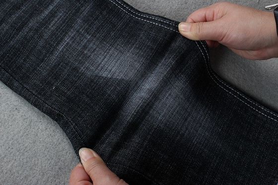 Prezzo buono Tessuto del denim dell'elastam del poliestere del cotone di GOTS 12.8Oz per i jeans Stocklot dell'uomo della donna in linea