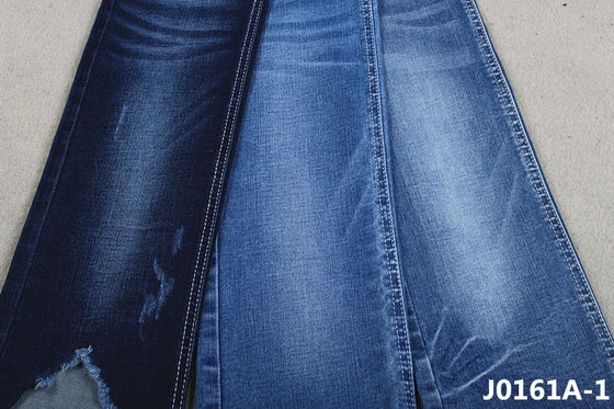 Prezzo buono La sanforizzazione Stretchable ritorce facilmente il tessuto del denim di 10 Oz per i jeans scarni delle donne dell'inverno della primavera in linea