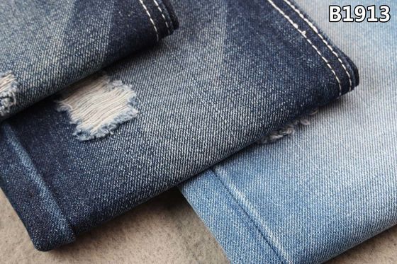 Prezzo buono blu di indaco del tessuto del denim del poliestere del cotone 13.5oz che sanforizza i jeans in linea
